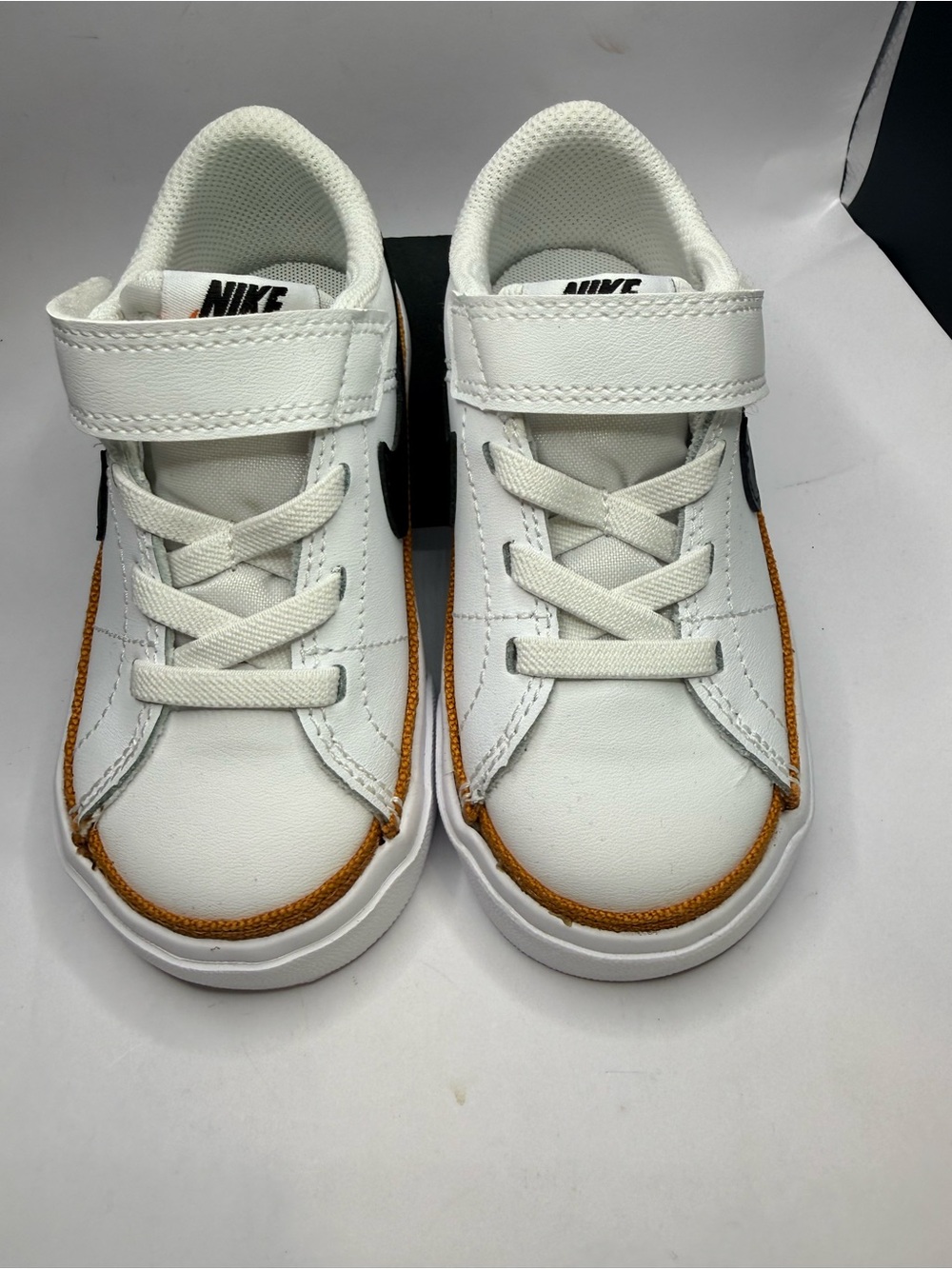 New 7C Nike Kids White Sneakers with Brown Trim and Black Swoosh